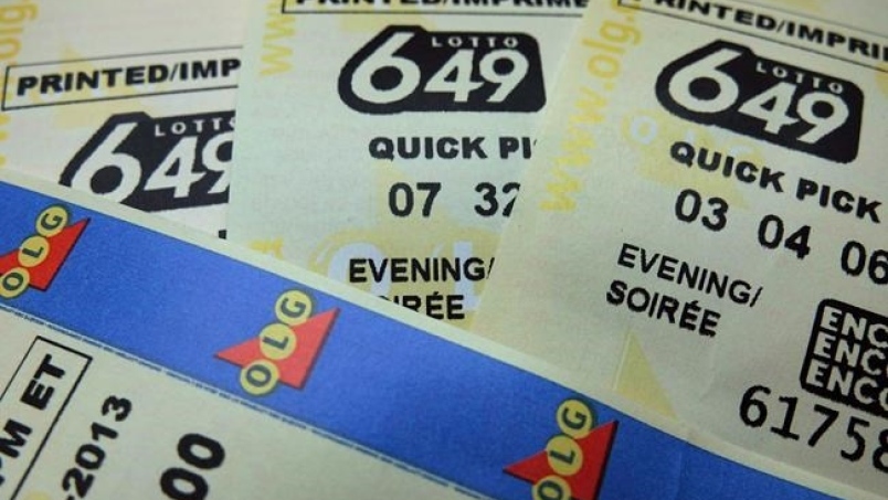 Lotto 649 tickets are shown in Toronto in on December 2, 2013. THE CANADIAN PRESS/Richard Plume