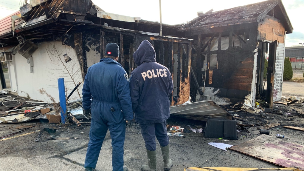 London police on scene of a Friday night fire at a former Dairy Queen in south London, Dec. 4, 2021. (Brent Lale / CTV News)
