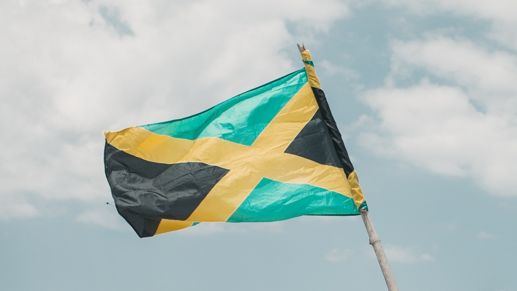 The Jamaican flag is seen in this stock photo. (Joey Nicotra/Unsplash)