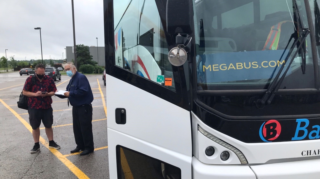 A passenger boards a Megabus at London, Ont.'s Flying J Truck Stop on Tuesday, Aug. 10, 2021. (Sean Irvine / CTV News)
