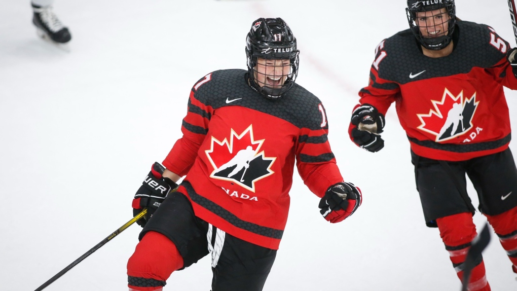 Canada's Ella Shelton, left, celebrates her goal with teammate Canada's Victoria Bach during second period IIHF Women's World Championship hockey action against Russia, in Calgary, Alta., Sunday, Aug. 22, 2021. THE CANADIAN PRESS/Jeff McIntosh