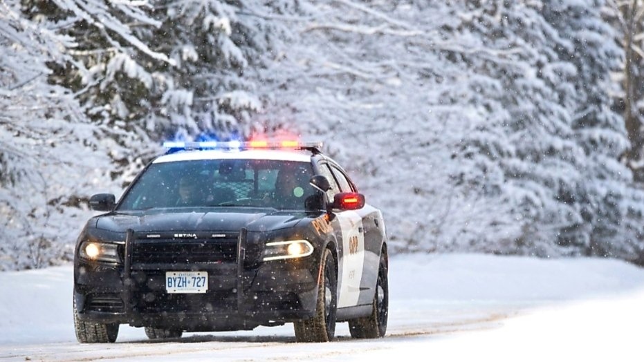 A provincial police cruiser navigates snowy weather in Ontario. (OPP_CR)