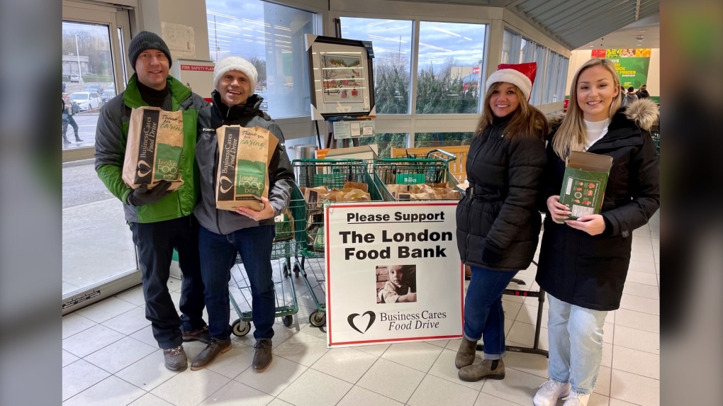 Nick Paparella and Jenn Basa of CTV News London were among those at the Food Basics in London, Ont. on Dec. 3, 2022 helping fundraise for the London Food Bank. (Sean Irvine/CTV News London)