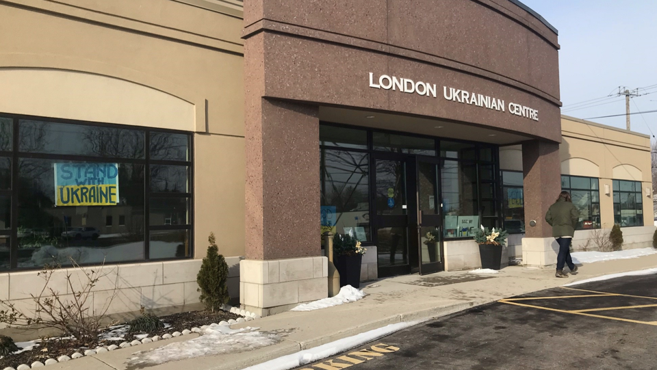 A woman making a donation leaves the London Ukrainian Centre on Adelaide St. S. In London, Ont. on March 1, 2022. (Sean Irvine CTV London)