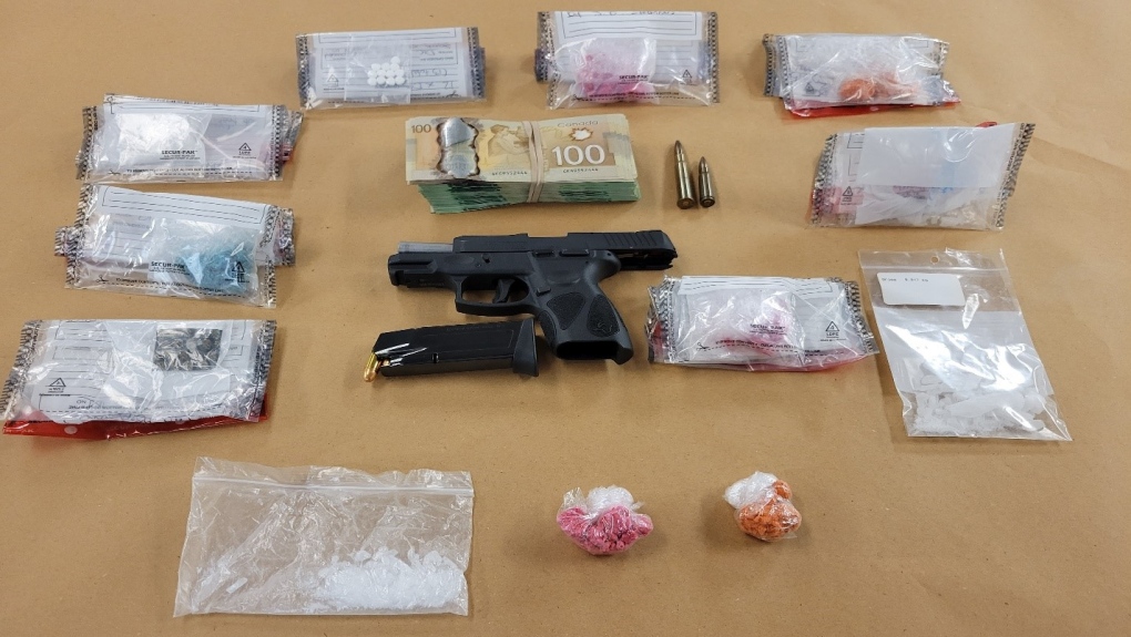 A handgun, cash and more than $21,000 worth of drugs were seized by police following a police investigation on May 12, 2022. (Source: London Police Service)