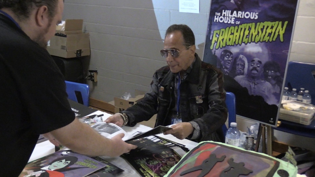 Mitch Markowitz of Hilarious House of Frightenstein signs autographs at Forest City ComiCon in London, Ont. on Saturday, June 25, 2022. (Bryan Bicknell/CTV News London)