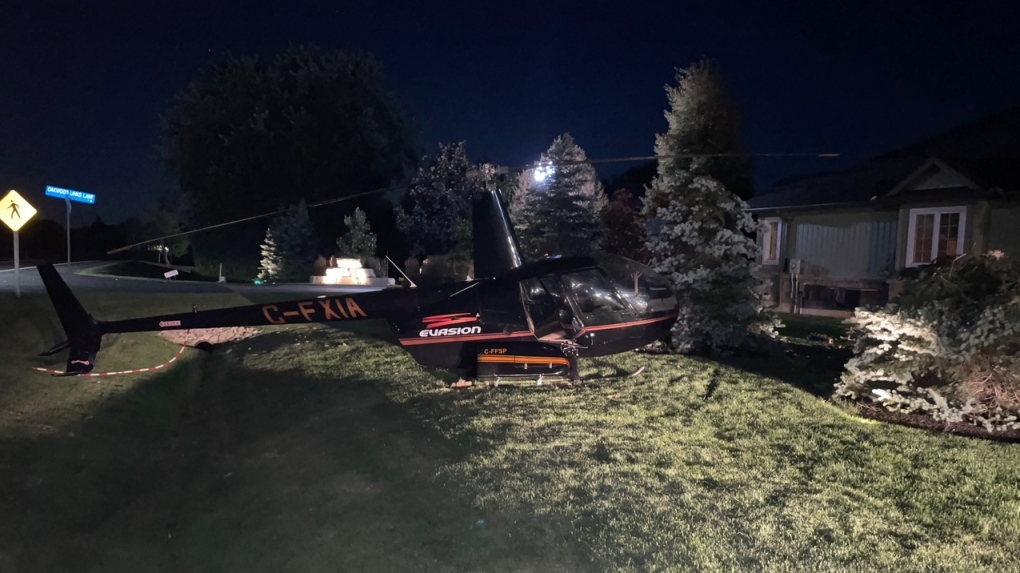 A helicopter made an emergency landing in front of a home on Bluewater Highway, just north of Grand Bend, Ont., on Thursday, Aug. 12, 2022. (Marek Sutherland/CTV News London)