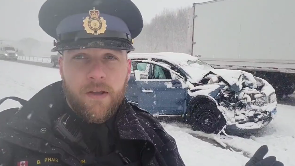 Elgin County OPP Const. Brett Phair shows viewers a vehicle that collided with a police cruiser on Highway 401, west of London, Ont., on Jan. 25, 2023. (Source: OPP West Region/Twitter) 