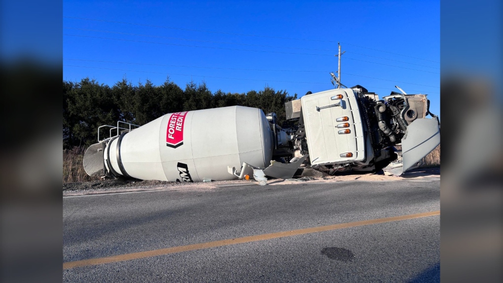 A two-vehicle crash between a cement truck and an old school bus shut down a section of Elginfield Road in Middlesex Centre, Ont. on Nov. 15, 2023. (Kristylee Varley/CTV News London) 