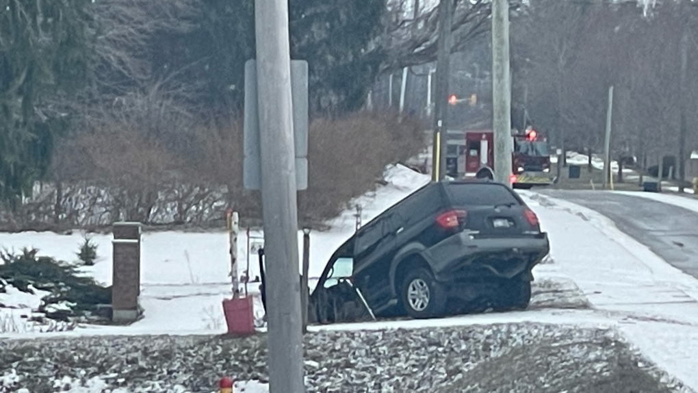 An SUV went down a small embankment on the south side of Commissioners Rd W, near Rosecliffe Terrace closing a section of the road in London, Ont. on Saturday, Mar. 18, 2023. (Gerry Dewan/CTV News London)