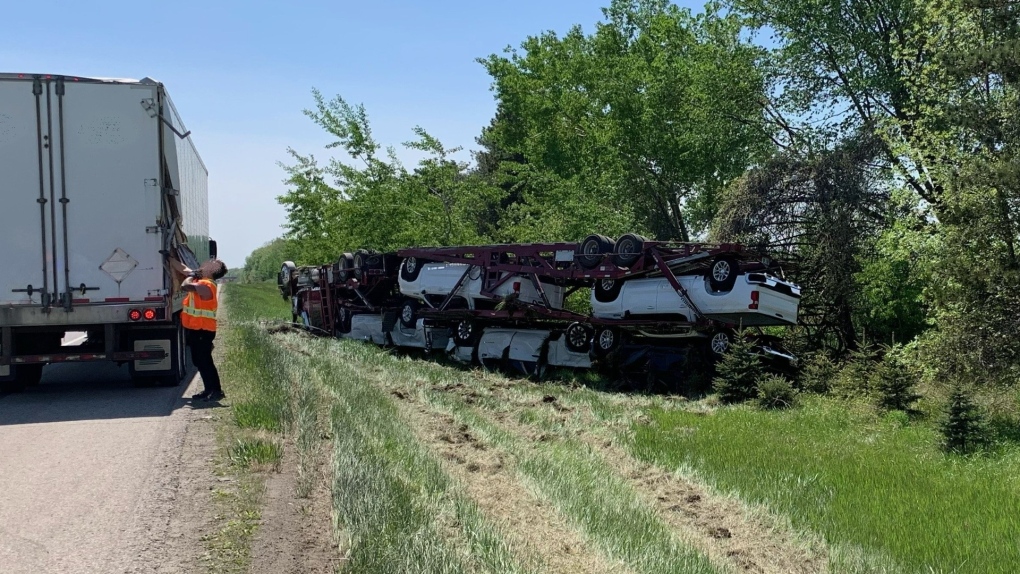The driver of a transport truck suffered minor injuries after a crash involving a second transport truck on Highway 401 in the Municipality of Dutton-Dunwich on May 15, 2023. (OPP West Region/Twitter)
