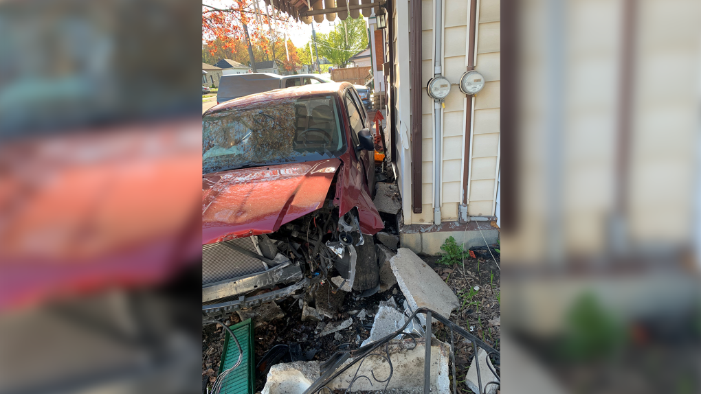 Van slams into house in Woodstock rupturing gas line