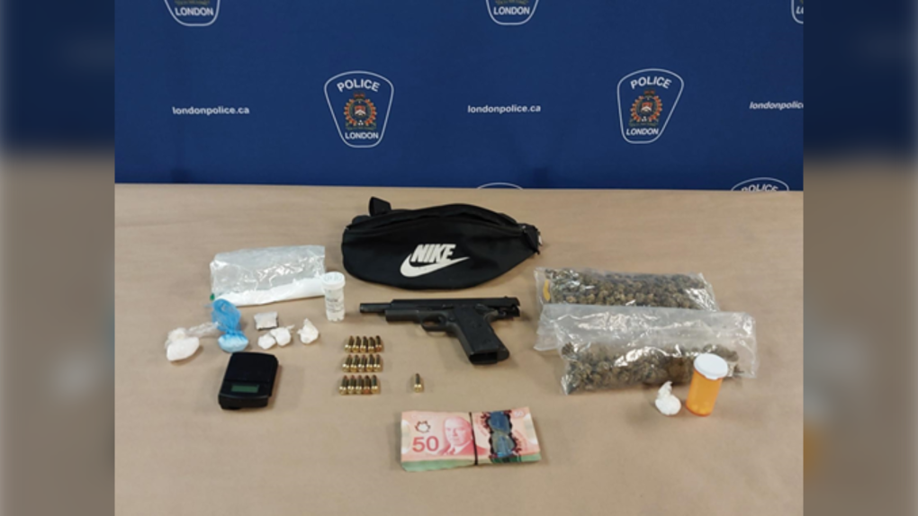 A semi automatic pistol, drugs and Canadian currency was seized by police after a youth pointing a weapon was reported in downtown London, Ont. on Sept. 20, 2023. (Source: London Police Service)