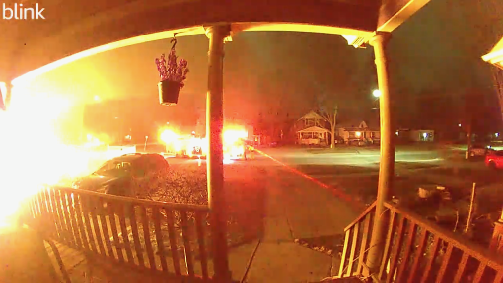 Video from a security camera next door shows flames shooting from 203 Colborne St. in London, Ont. on Feb. 11, 2024. (Source: Submitted)